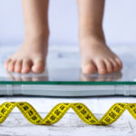 Weight,Control,Concept,With,Centimeter,In,Focus,And,Blurred,Kid's
